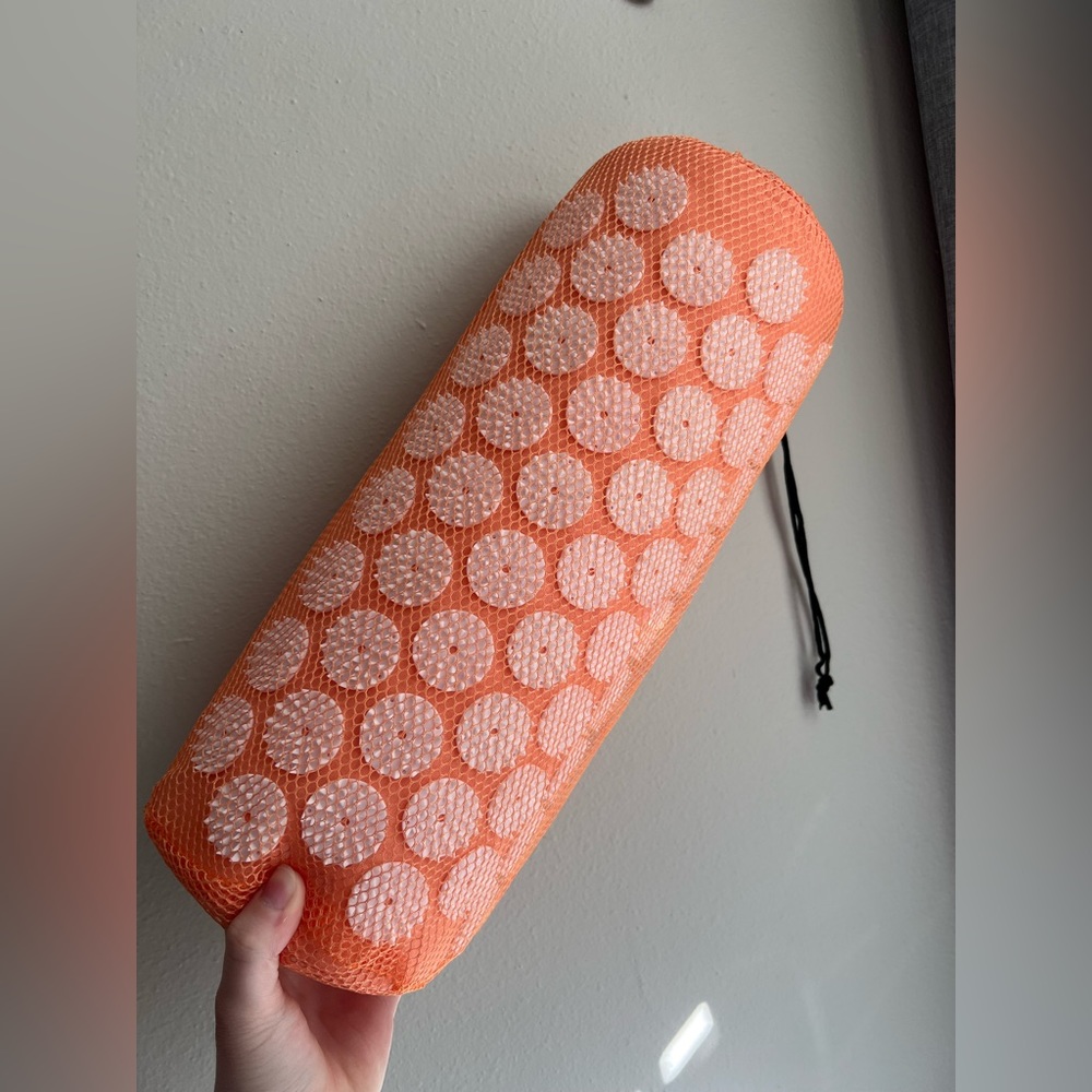 Balance collection orange acupressure pillow.